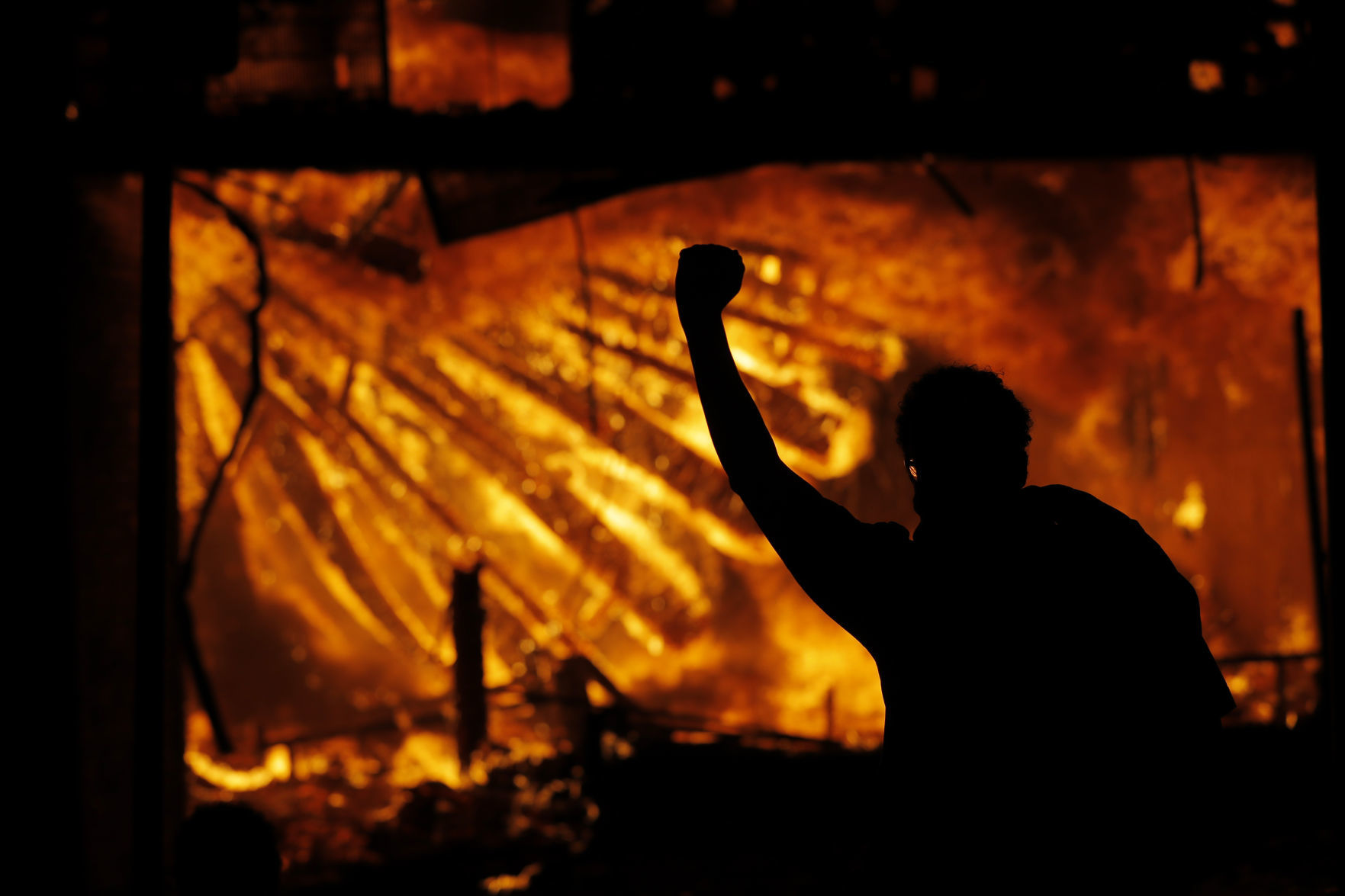 George Floyd protesters set Minneapolis police station afire